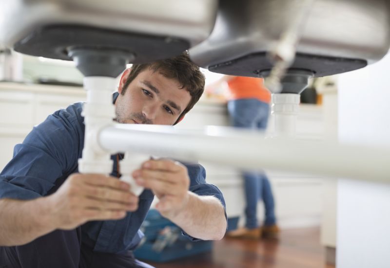 Plumber Performing Repairs